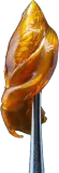 A metal tool holds a glob of translucent, golden-brown cannabis concentrate against a white background.