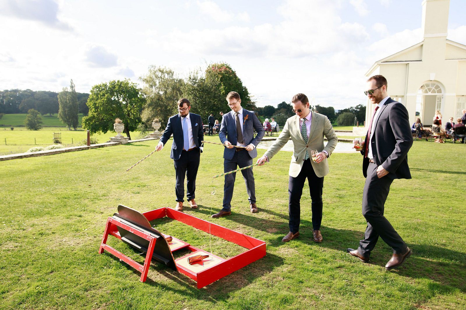 a group of men are playing a game in a field .