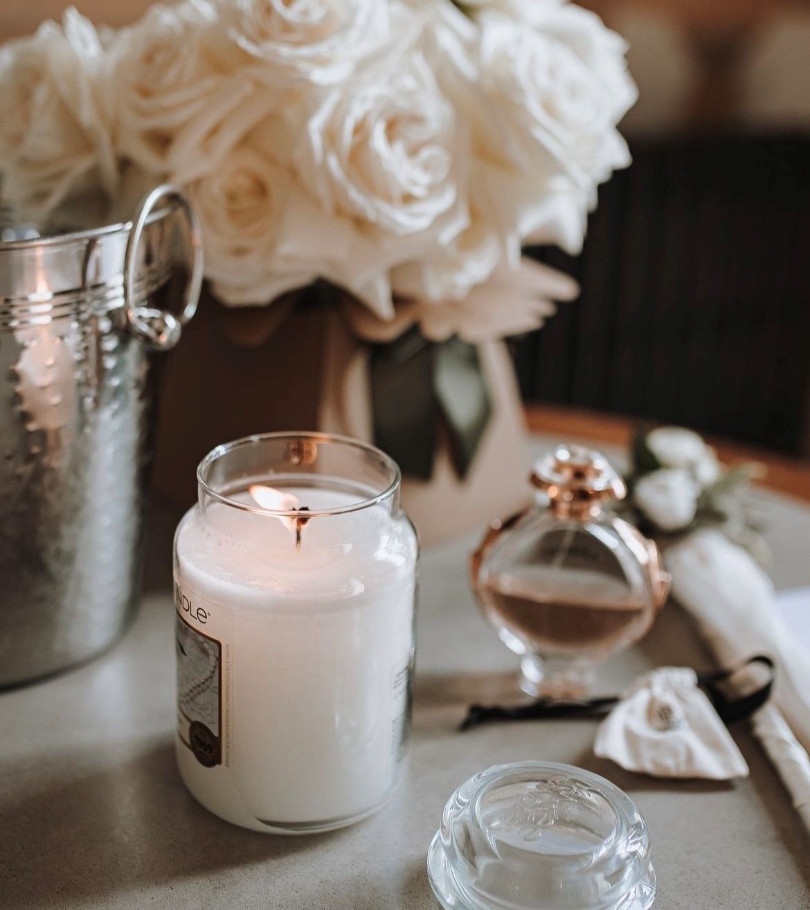 a bride and groom are sitting at a table signing a wedding register .