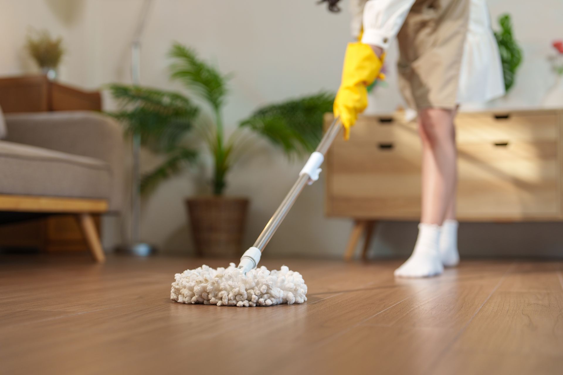 A vacuum cleaner is sitting on a carpeted floor in a room.