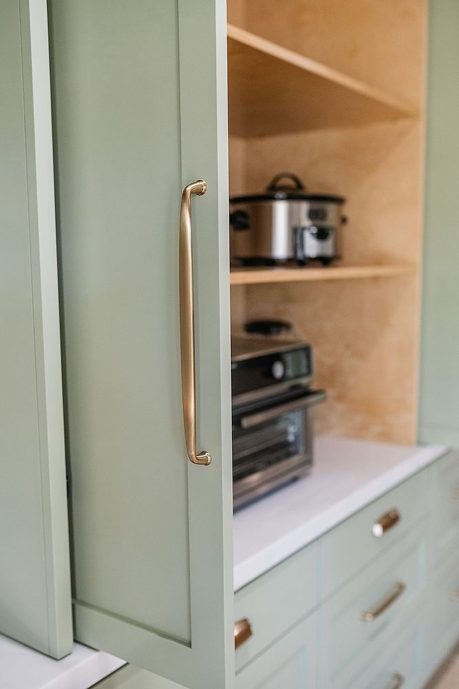 Full kitchen remodel in San Diego by Team Renovate . sage brush cabinets  - hidden cabinet