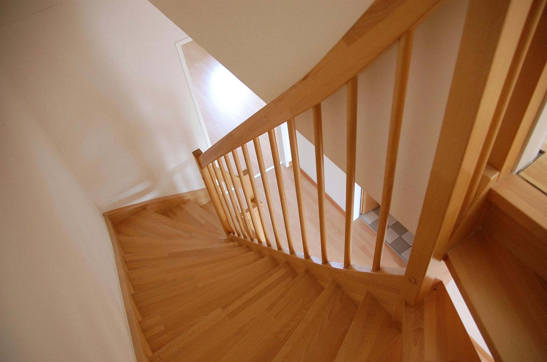 The stairs are made of wood and have a wooden railing.