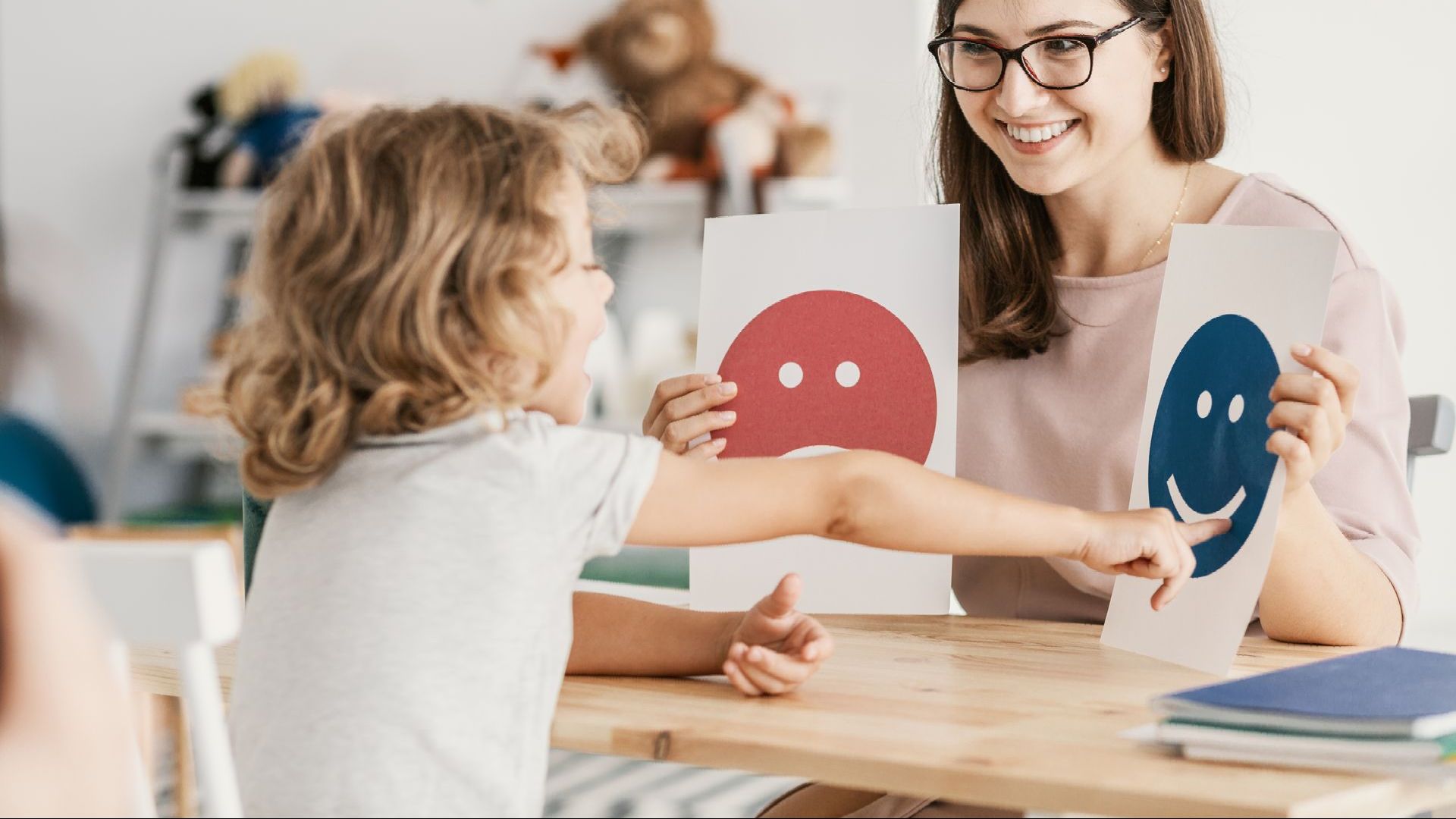 A girl pointing on a smiley face