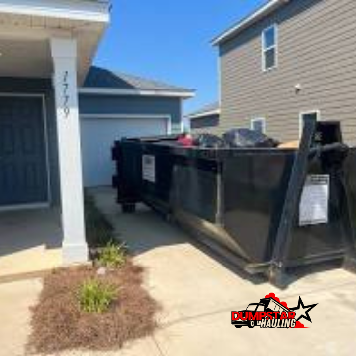 A clean 15-yard dumpster on a residential driveway ready for us
