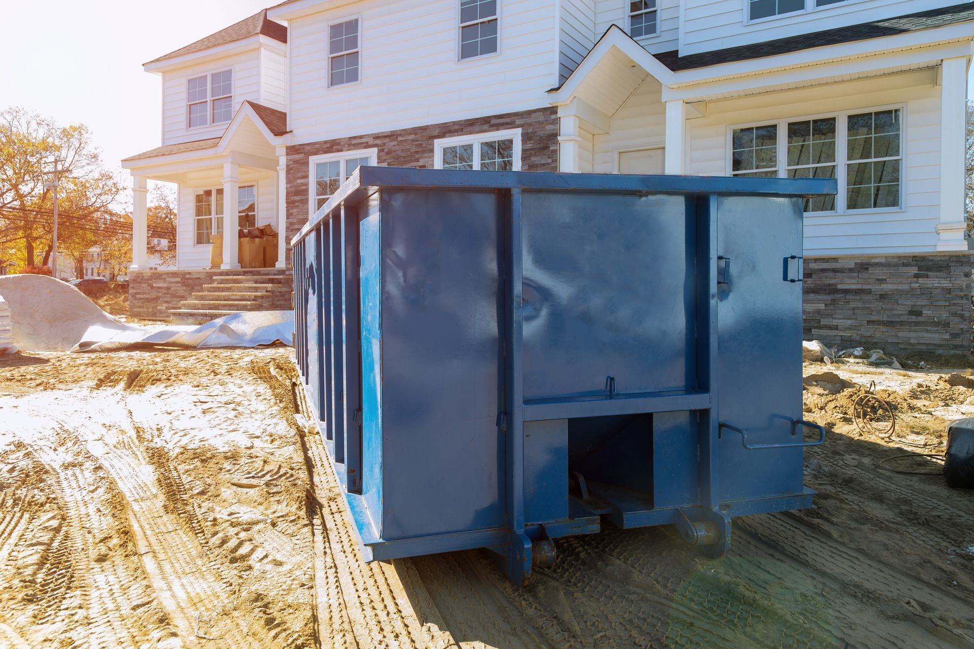 Efficient waste removal using a heavy-duty dumpster rental on a new building development site. Efficient waste removal using a heavy-duty dumpster rental on a new building development site.
