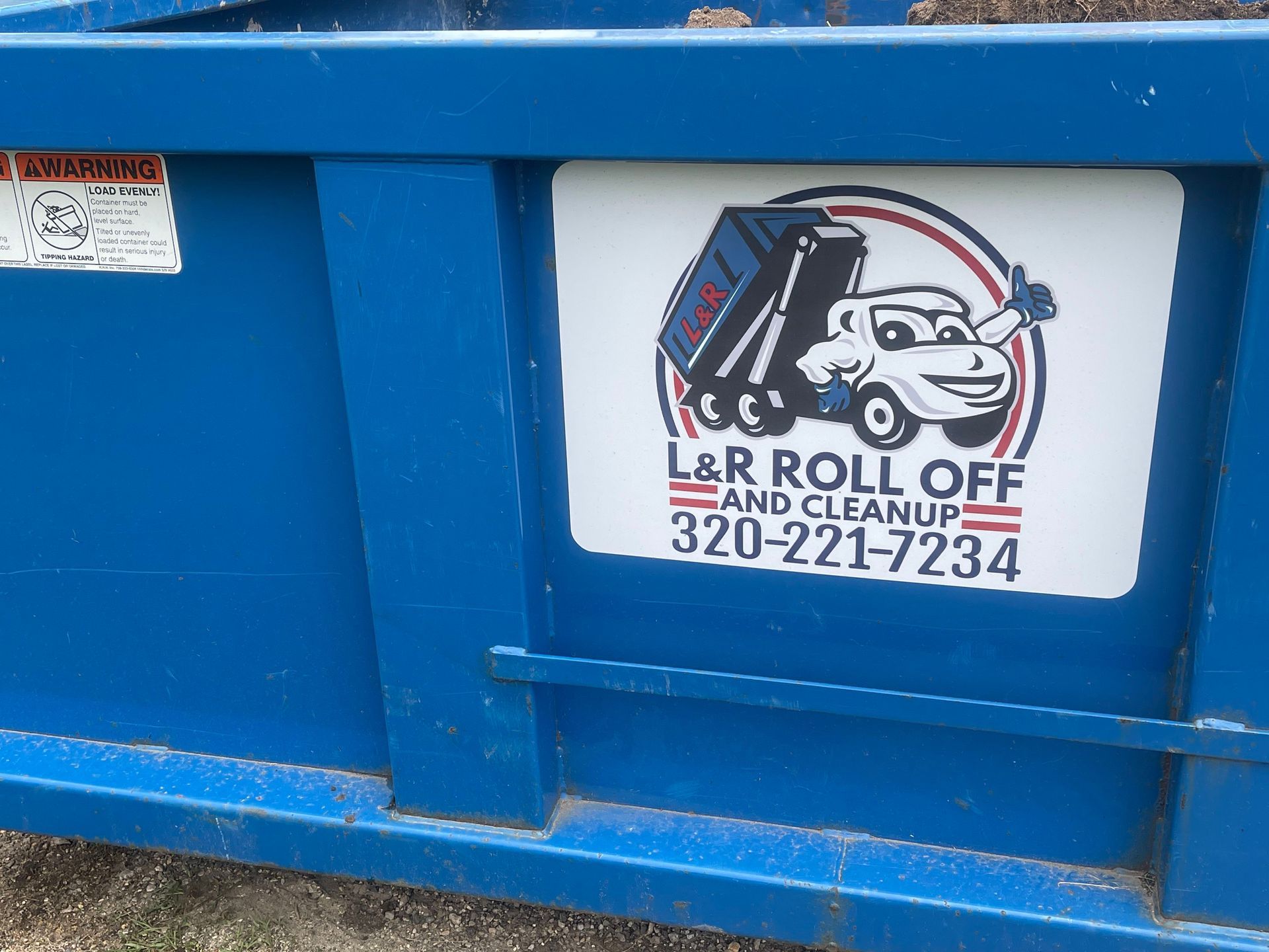 Blue roll-off dumpster with L&R Roll Off and Cleanup logo.