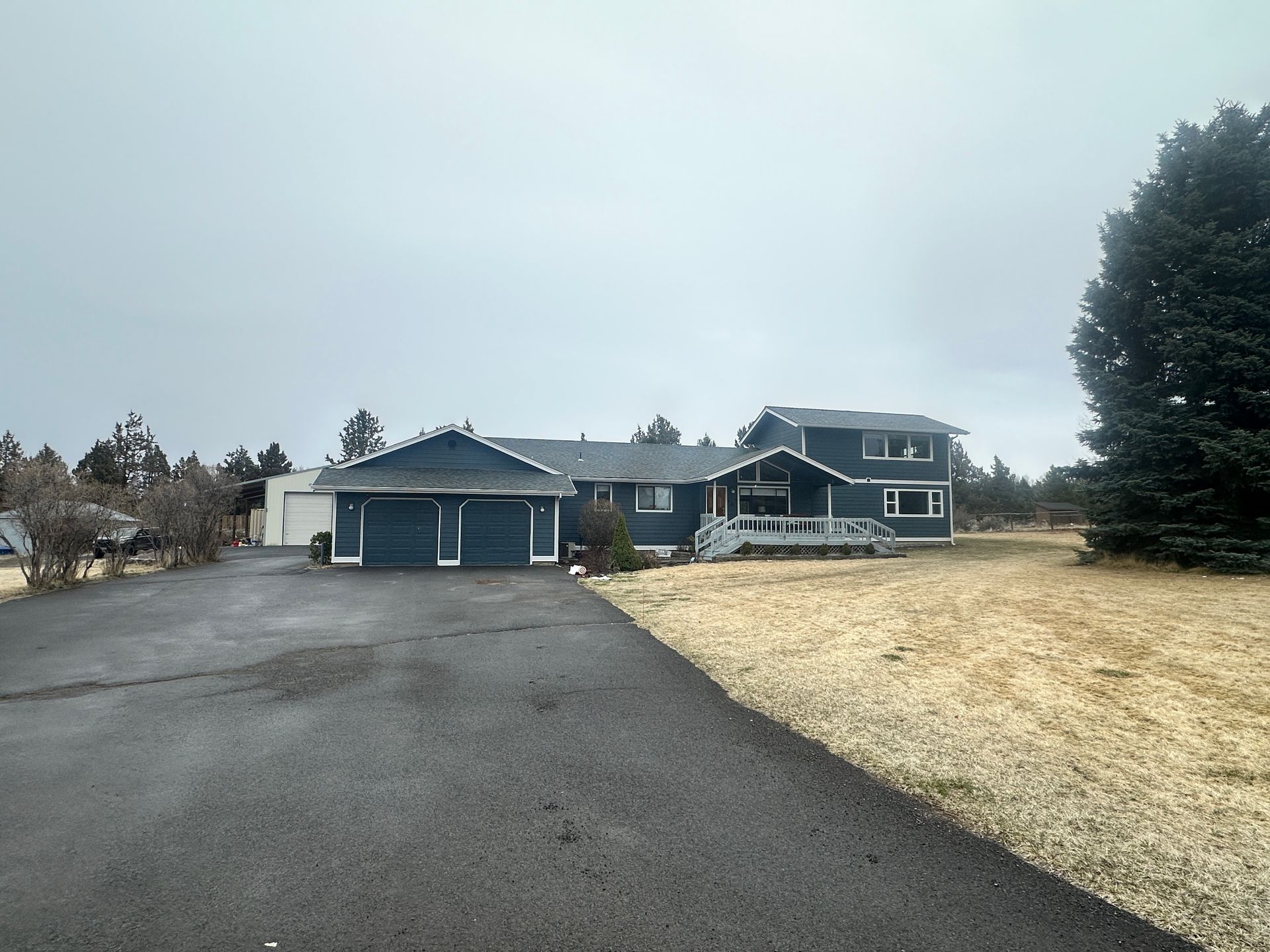 A large house with a driveway in front of it