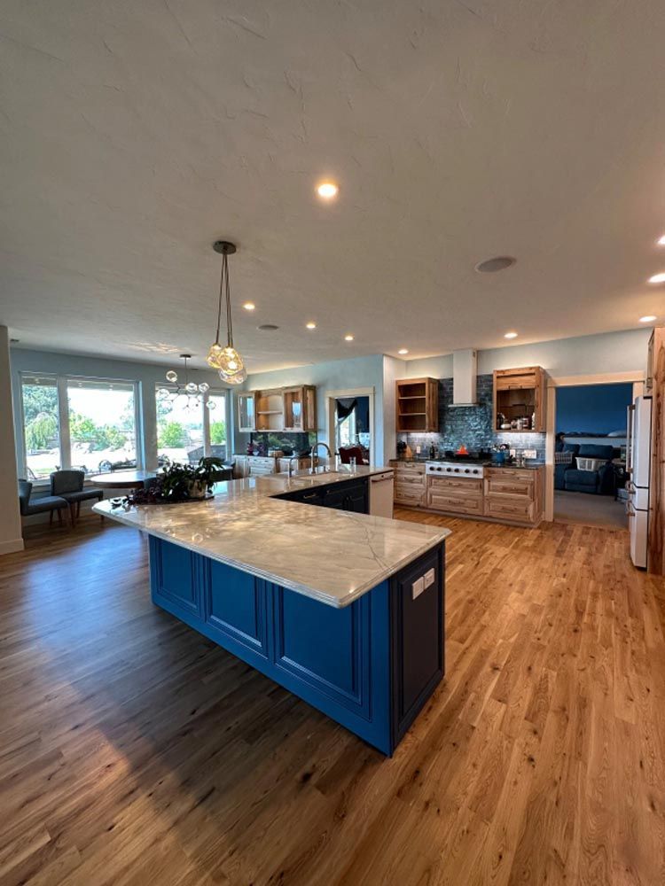There is a large island in the middle of the kitchen.