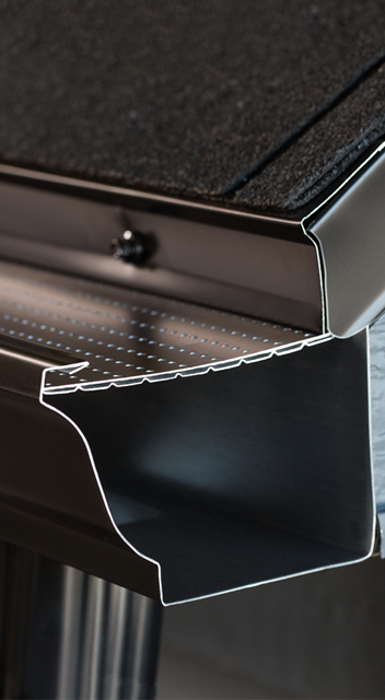 Black metal shelf bracket under a glass or acrylic shelf, shown in close-up detail
