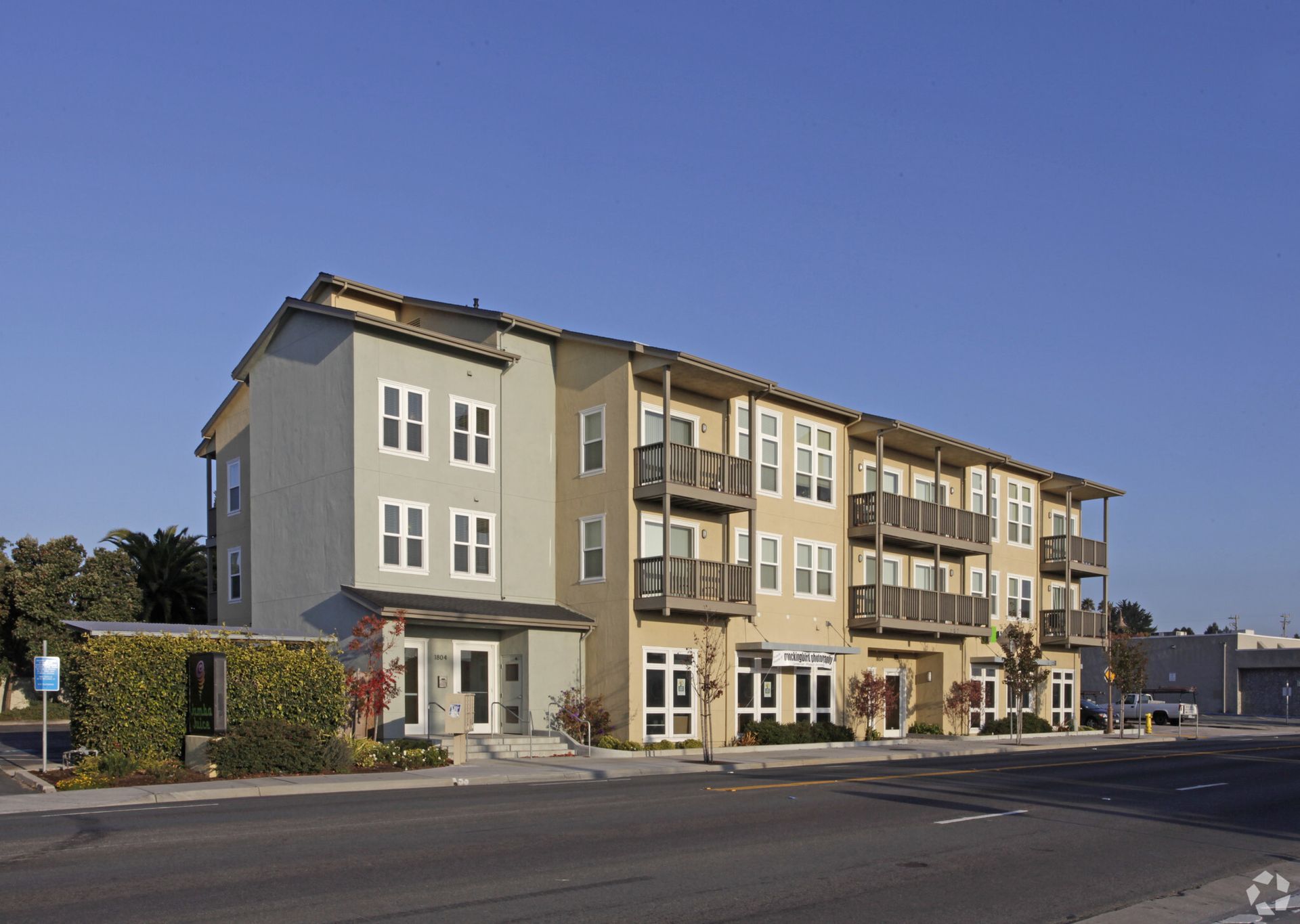 A large apartment building with a lot of windows and balconies
