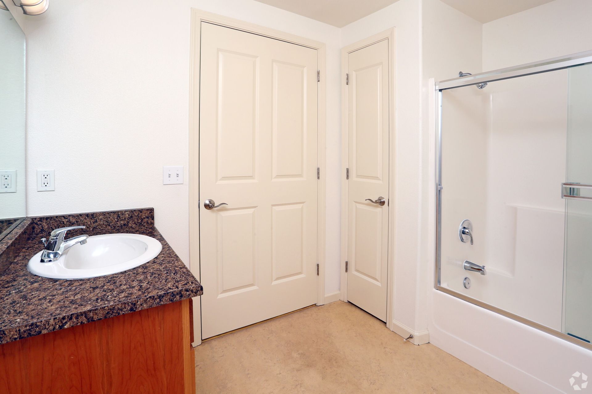 A bathroom with a sink and a bathtub