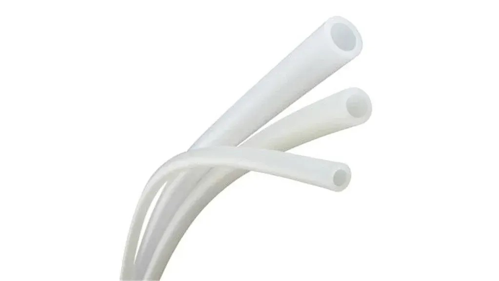 White flexible tubing, three pieces angled against a white background.