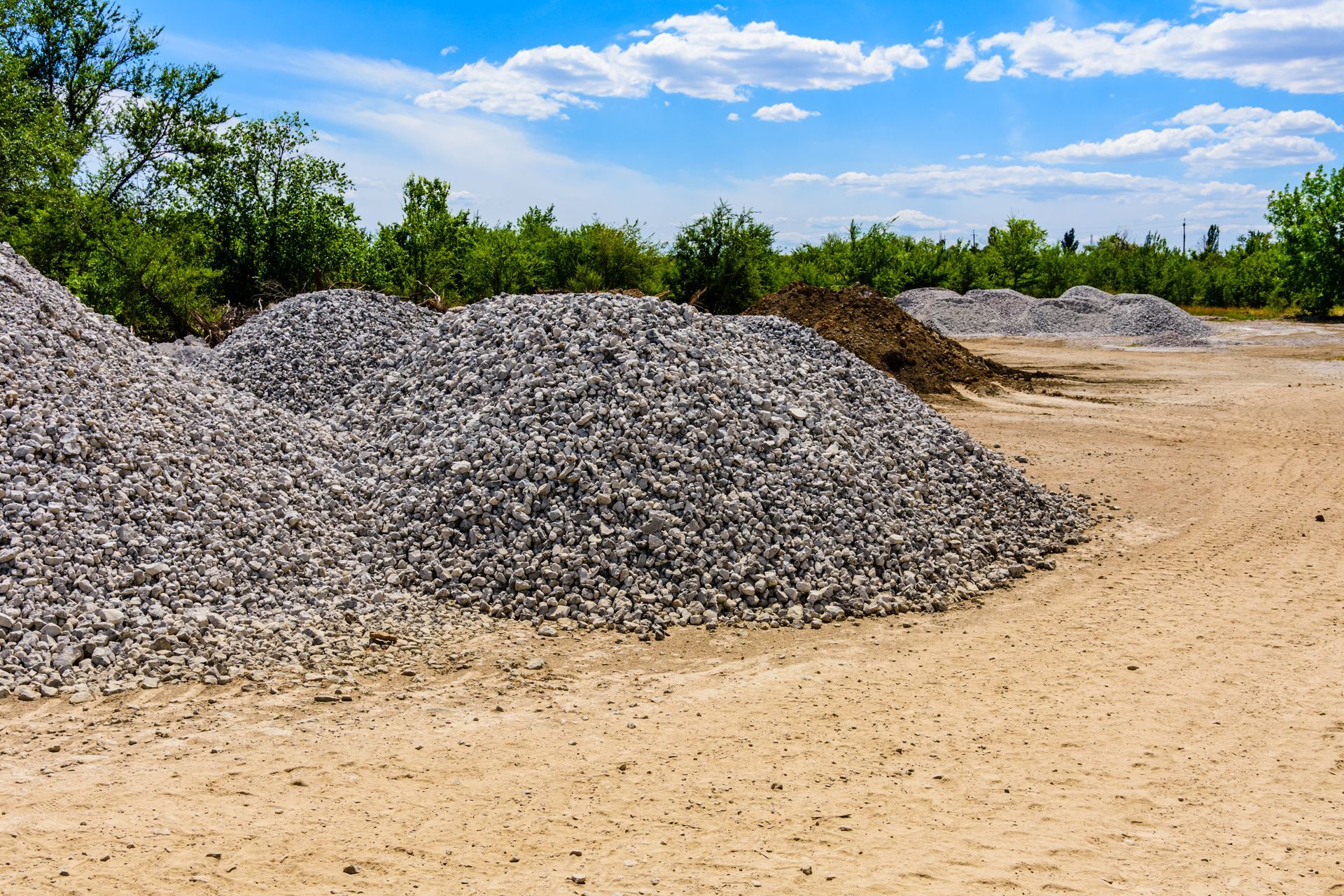 Big piles of rubble near the roadside