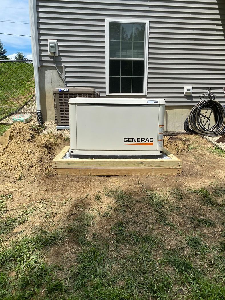 Outdoor Generac generator beside a house on a concrete pad, with a window and utility equipment nearby