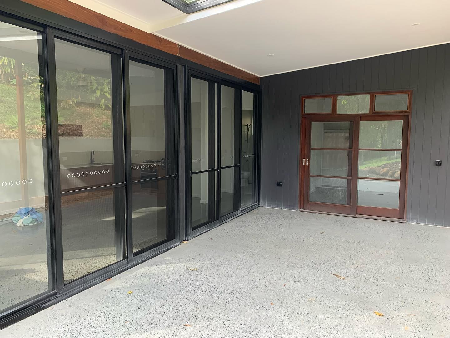 A large room with a lot of windows and doors.