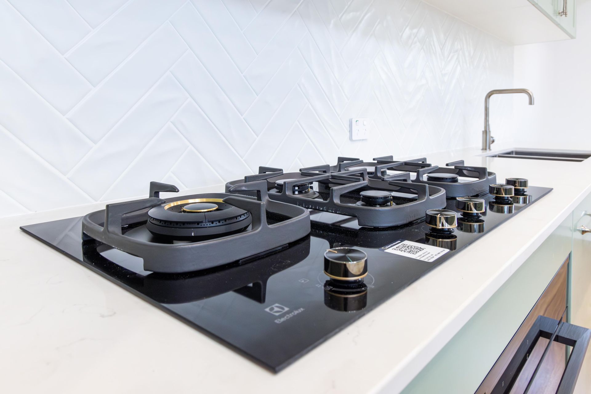A stove top oven is sitting on top of a counter in a kitchen.
