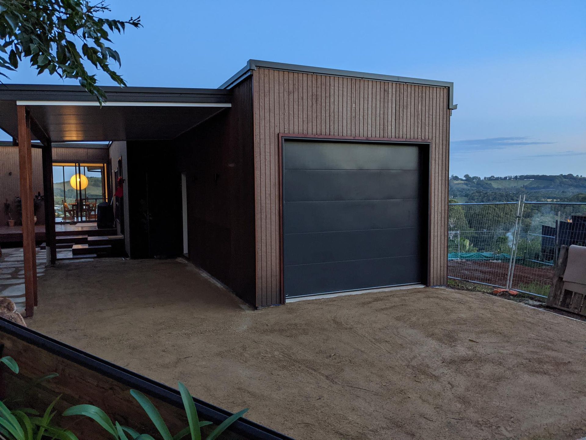 A house with a garage and a driveway in front of it