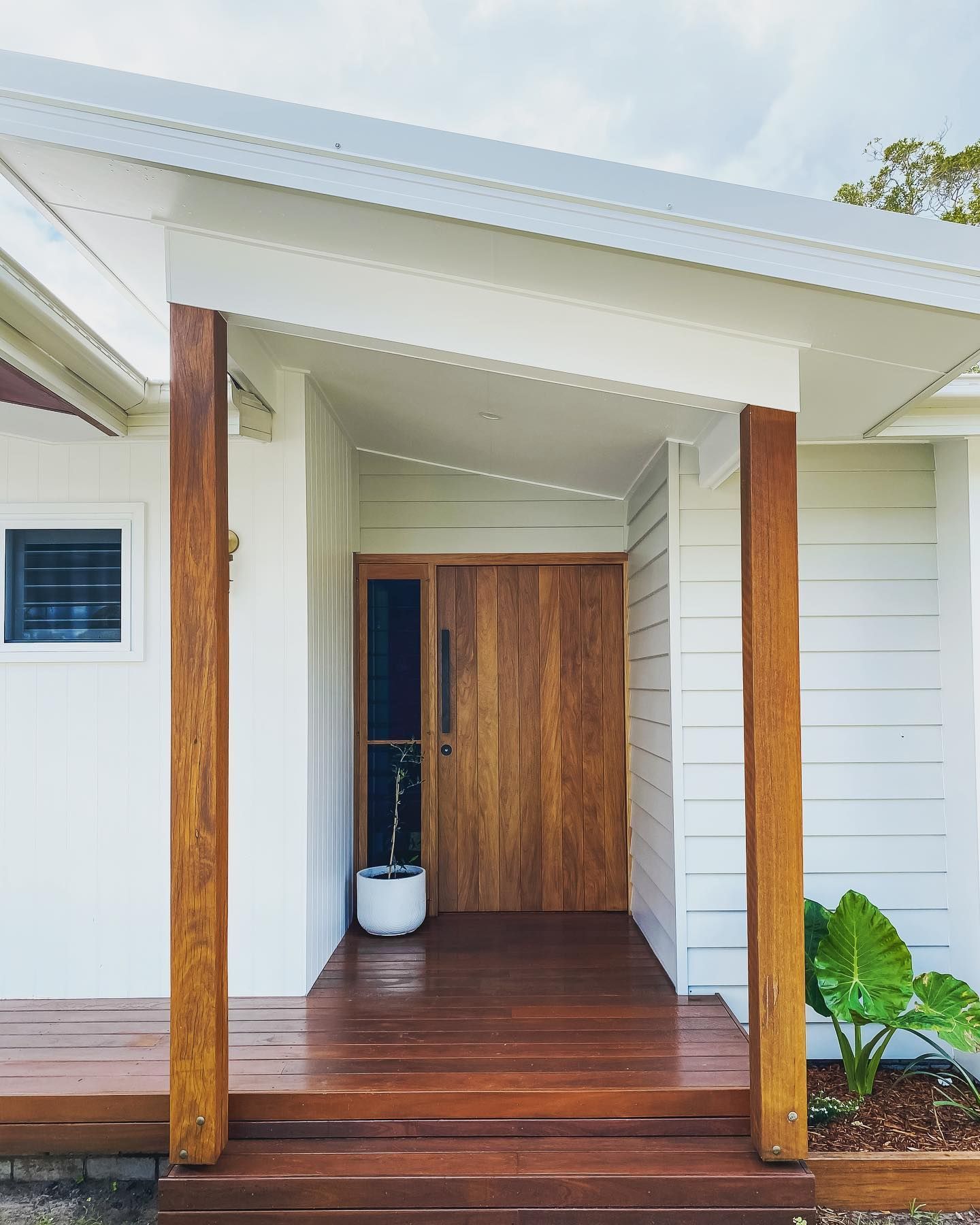 Tweed Heads coastal entry — timber front door and weatherboard façade by local builders.