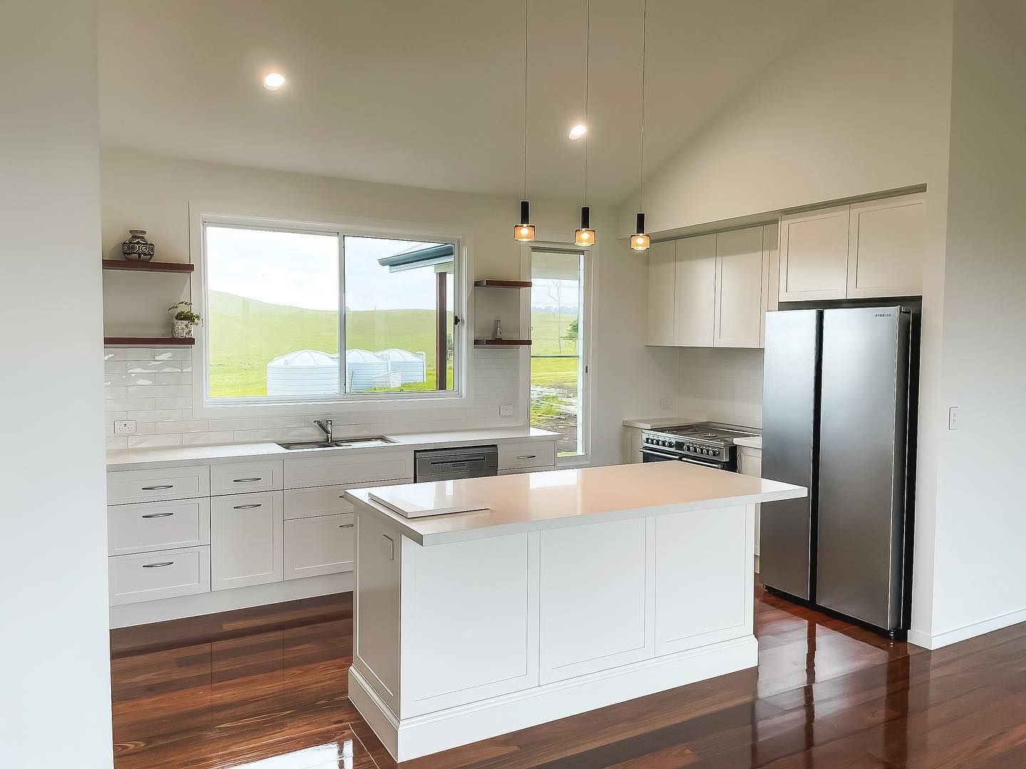 There is a large island in the middle of the kitchen.