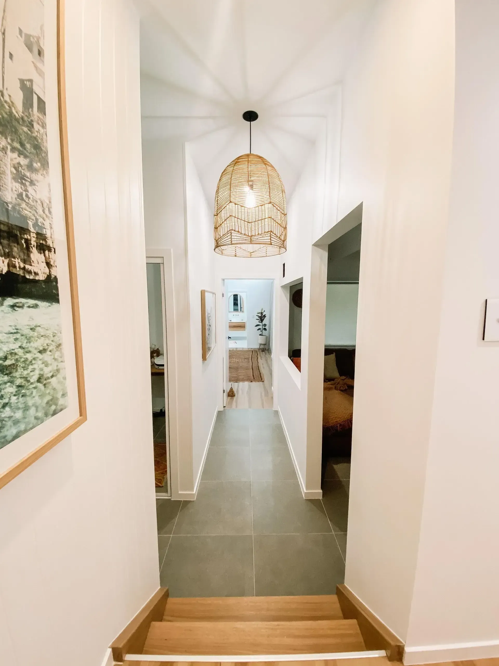 Tweed Heads home renovation — light-filled hallway with feature pendant by IVO Constructions.