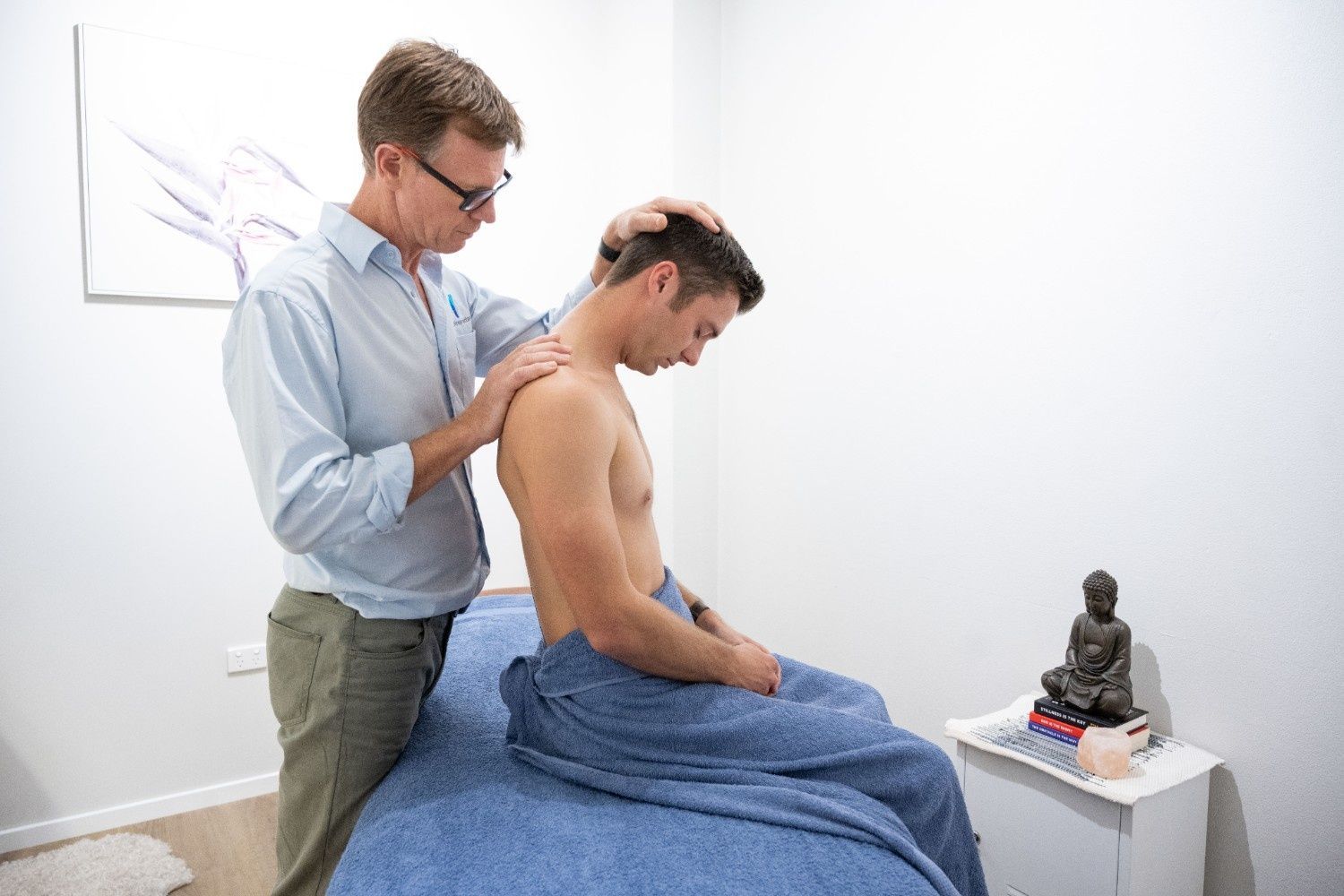 Man Receiving Neck and Shoulder Massage in Clinic Setting — My Chiropractor Mackay City in Mackay, QLD