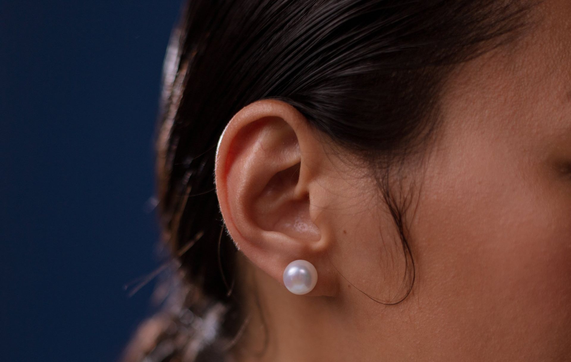 Close-Up of A Person's Ear with A Pearl Earring — My Chiropractor Mackay City in Mackay, QLD
