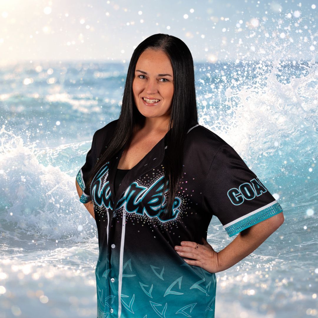 Woman in a black and teal jersey with 