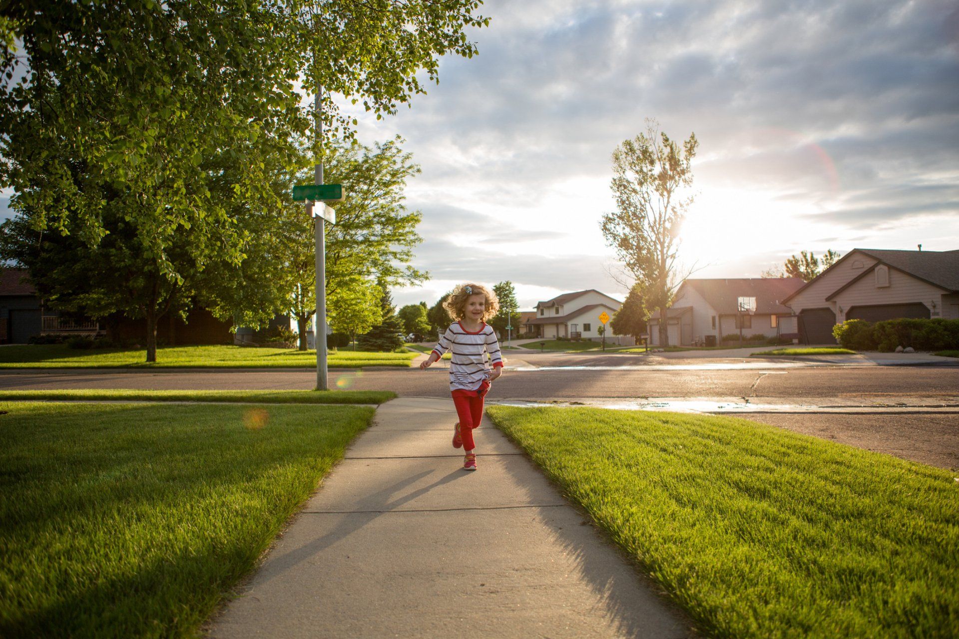 Little Girl Running in the Yard — Vass, NC — Precision Tree Trimming and Removal LLC