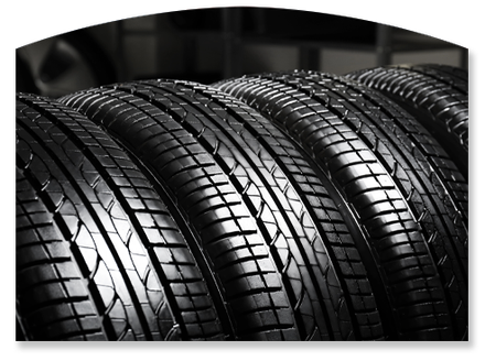 Rows of black car tires stacked side by side