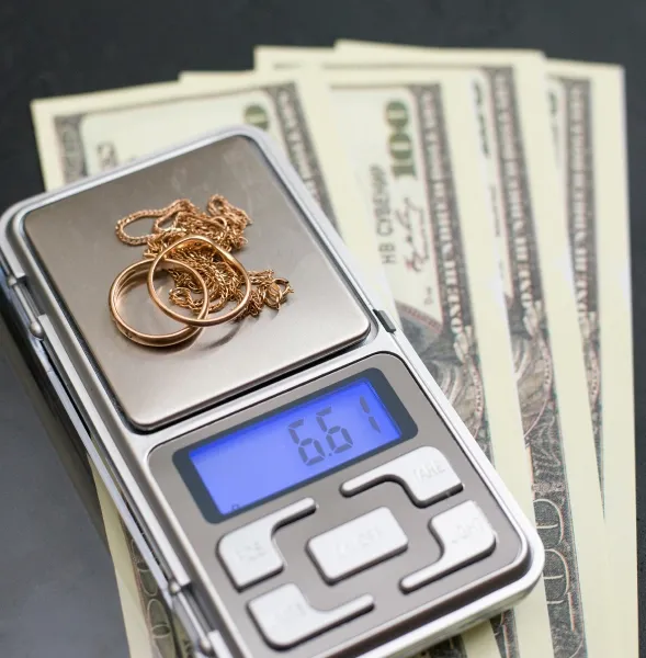 Gold jewelry on a scale, Jake's Cash for Gold, Edison, NJ.