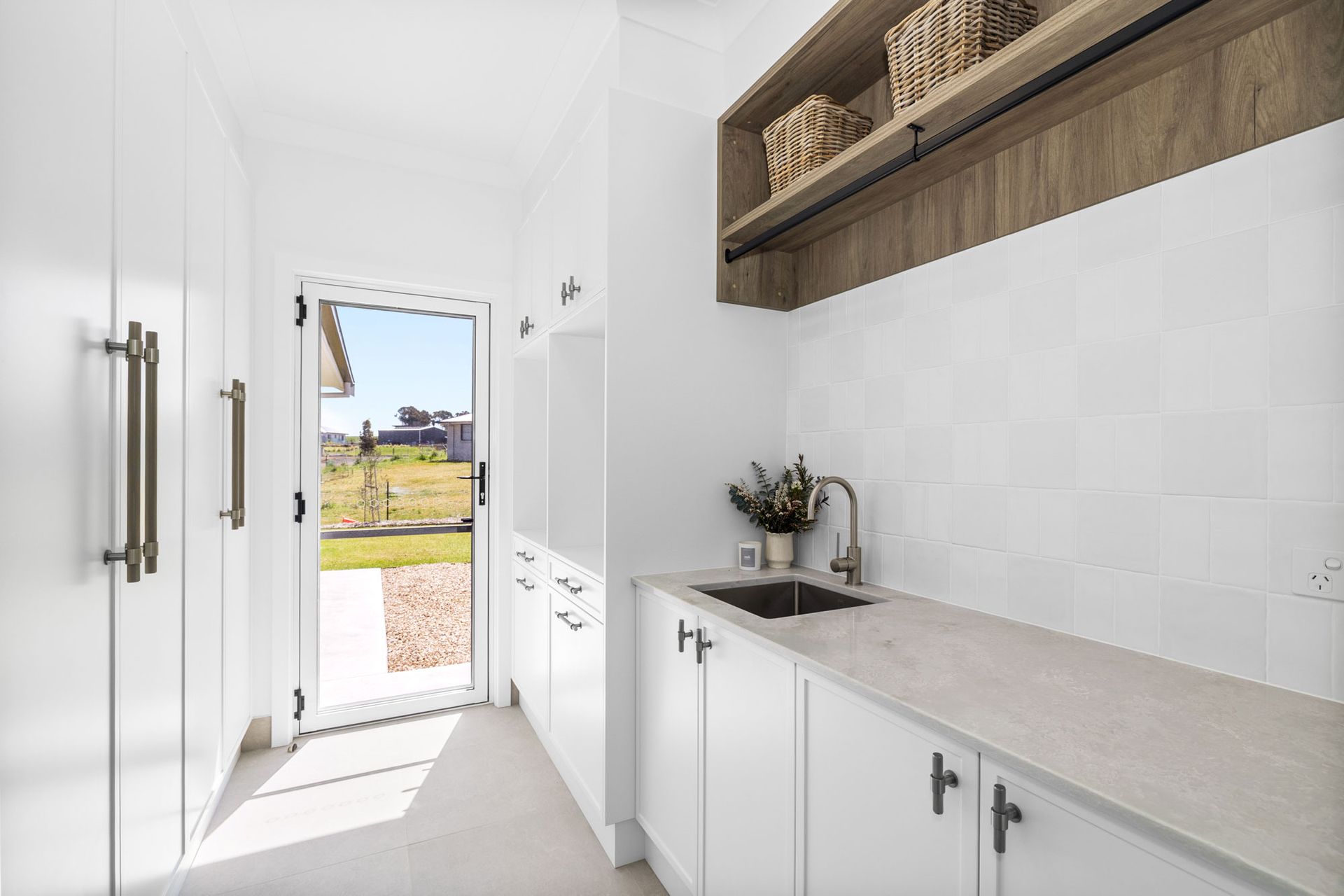 A close up of a kitchen cabinet with a wooden counter top.