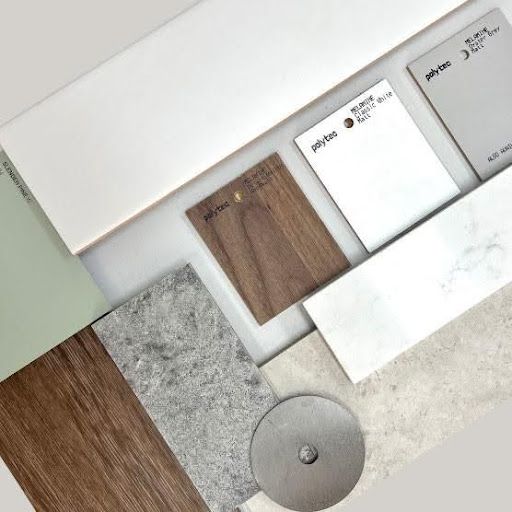 A kitchen with wooden cabinets and a bottle of wine on the counter