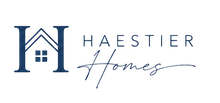 A blue and white logo for a real estate company.