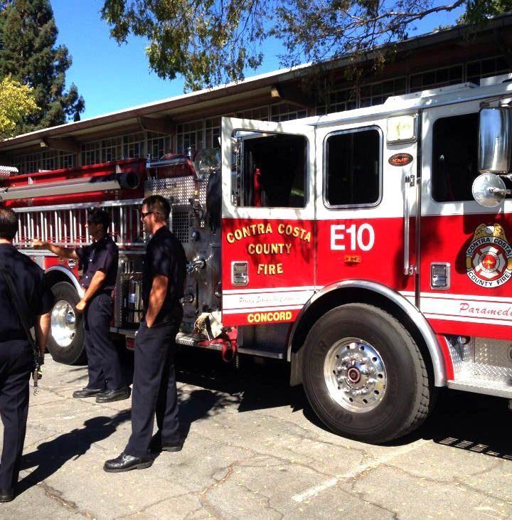 A red and white contra costa county fire truck