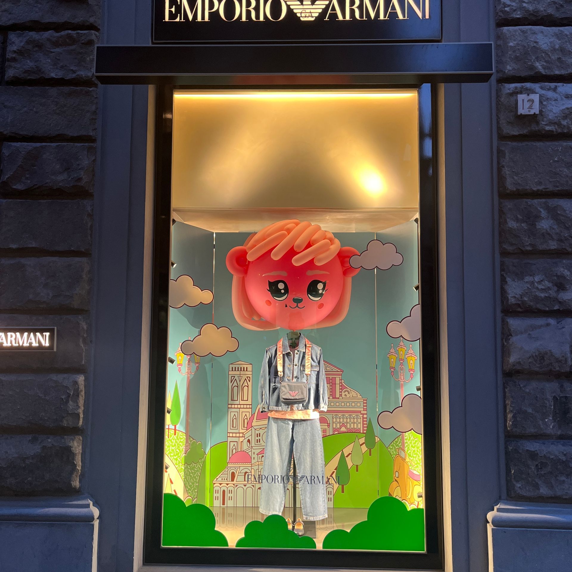 Emporio armani store front with a mannequin in the window