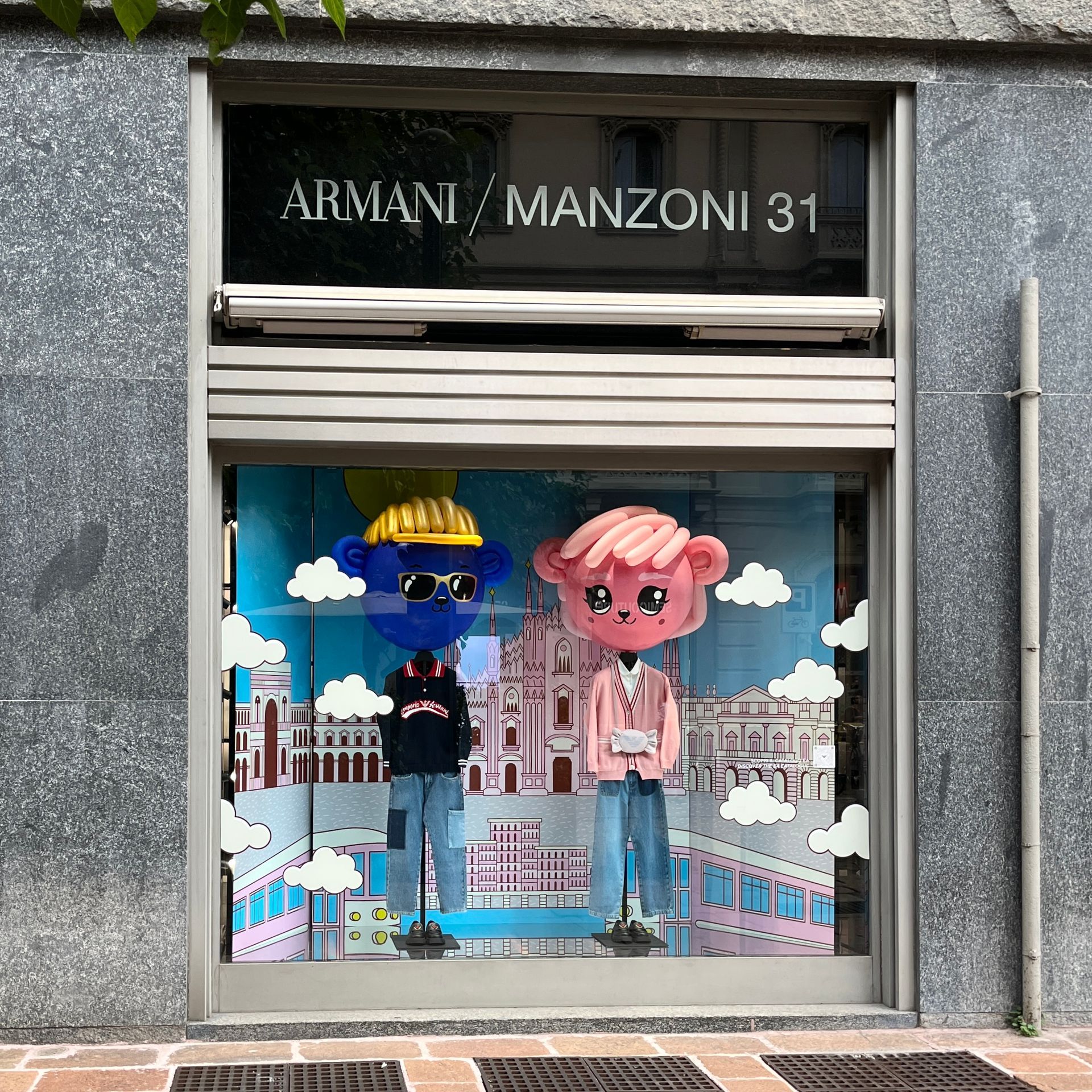 A store front with a window display for armani manzoni 31
