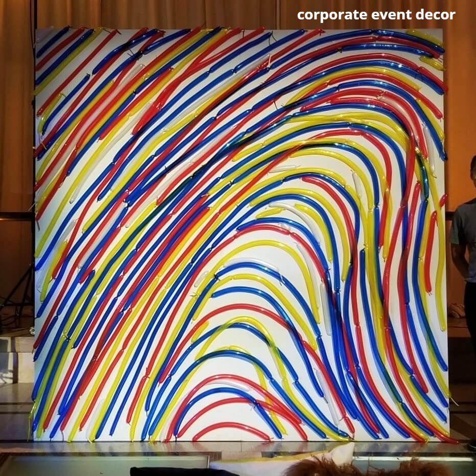 A colorful painting with the words corporate event decor below it