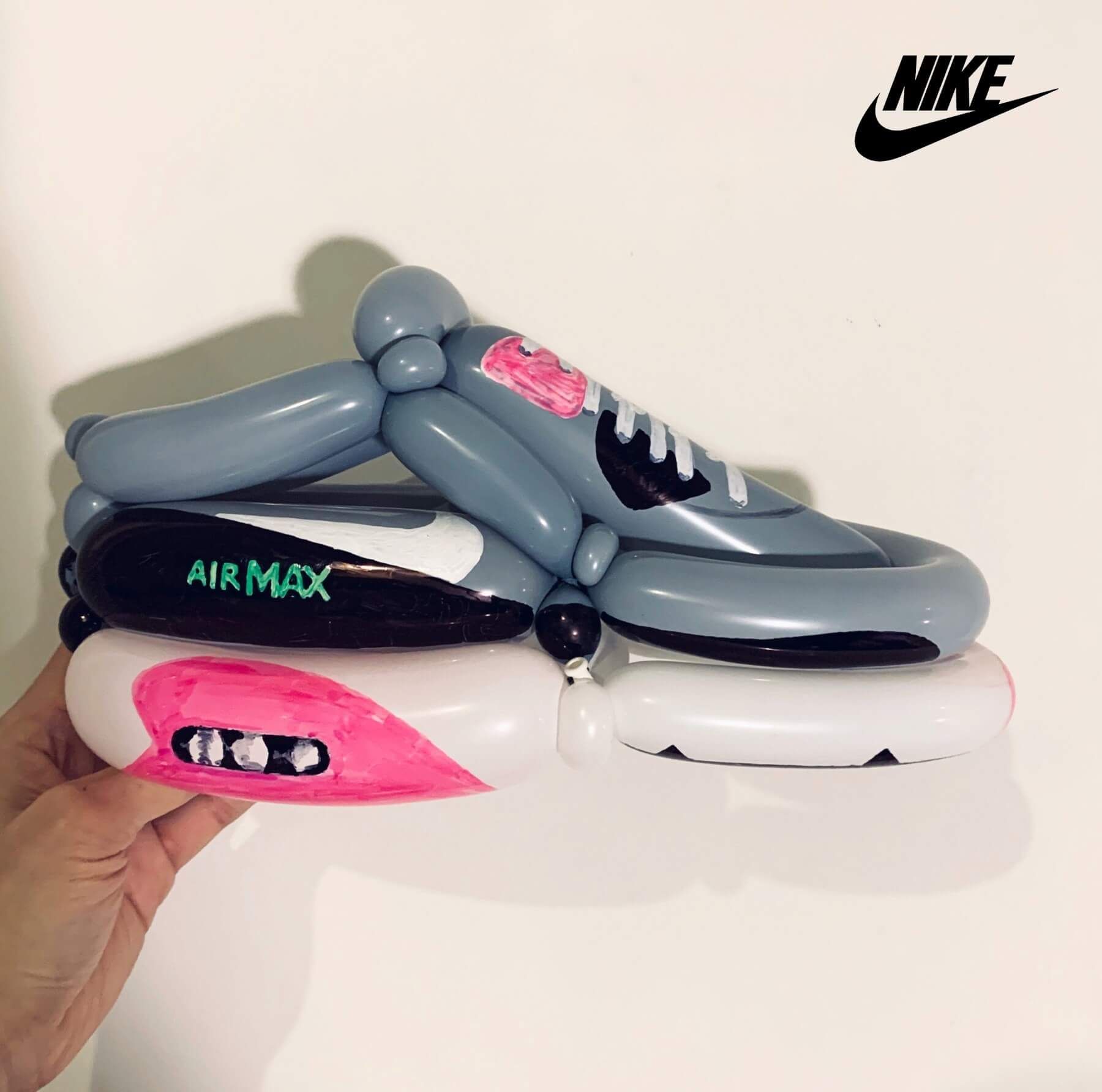 A pair of nike air max shoes made out of balloons