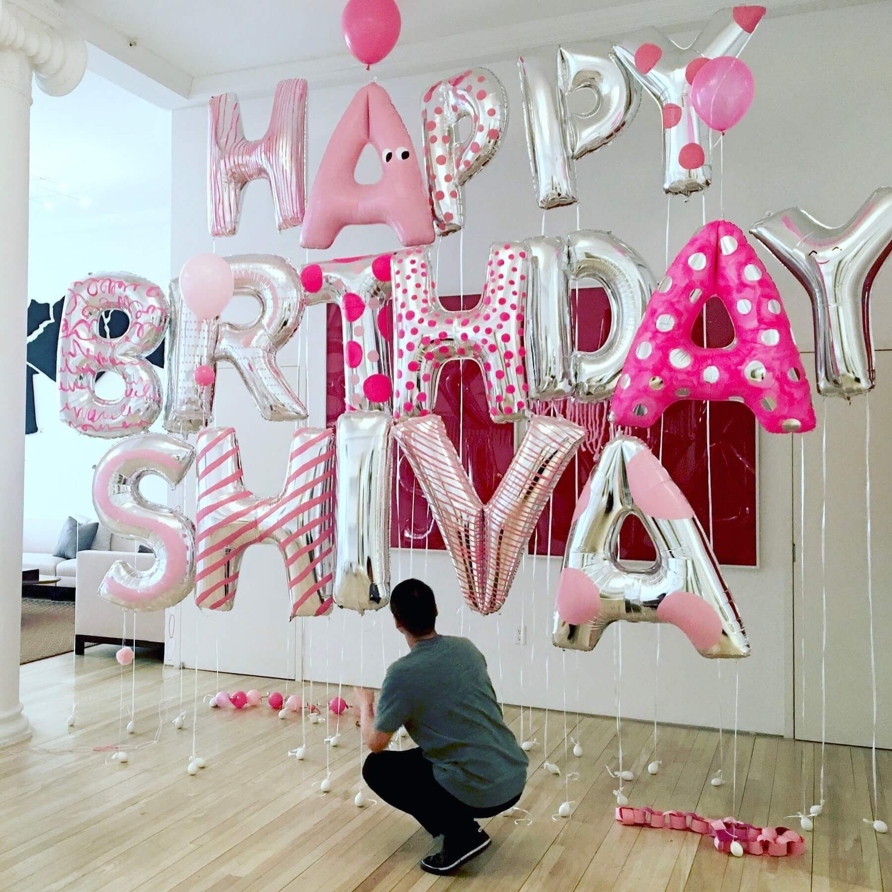 Person setting up pink and silver 