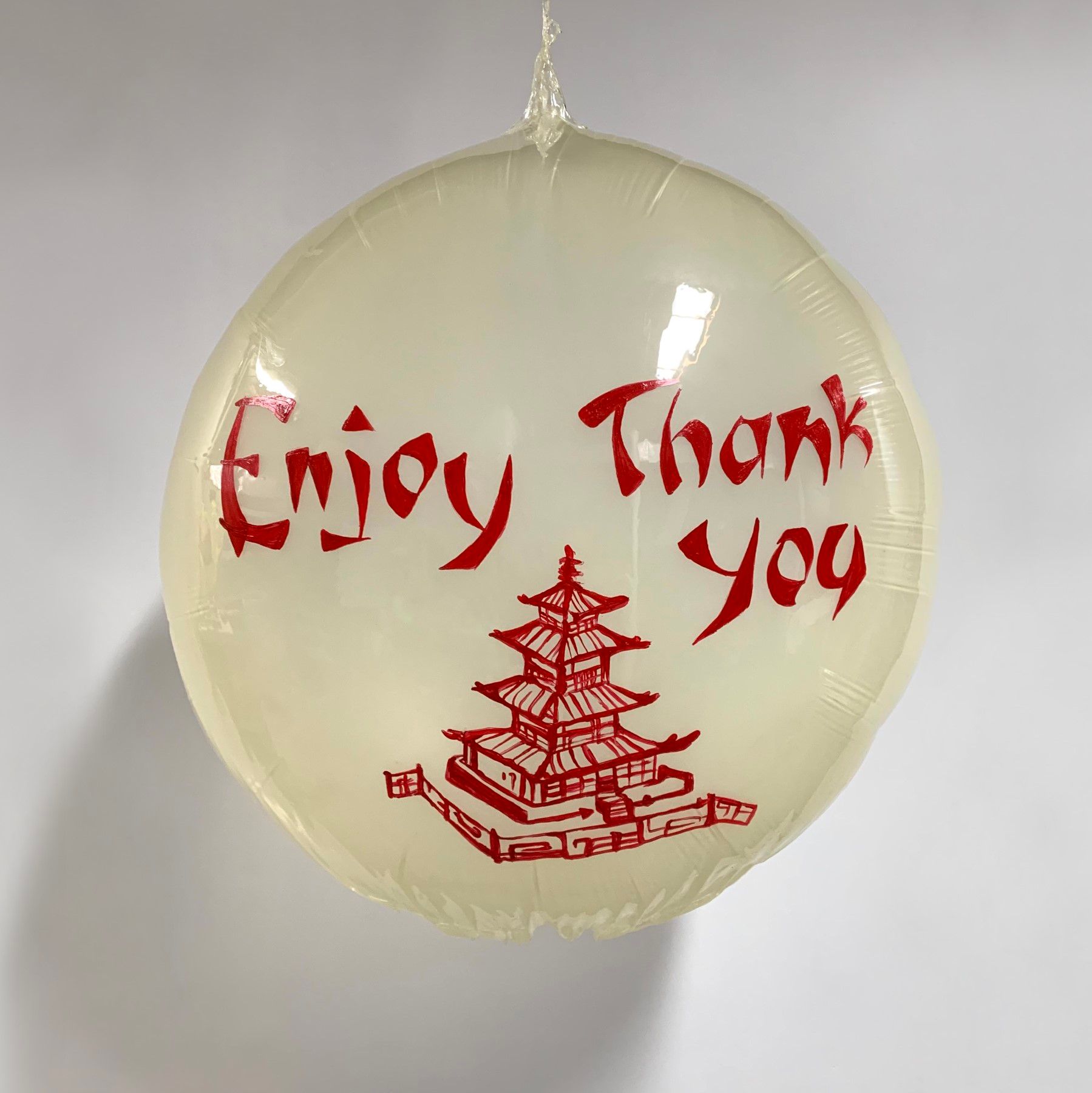 A balloon that says enjoy thank you on it