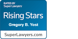 A blue sign that says rising stars gregory b. yost