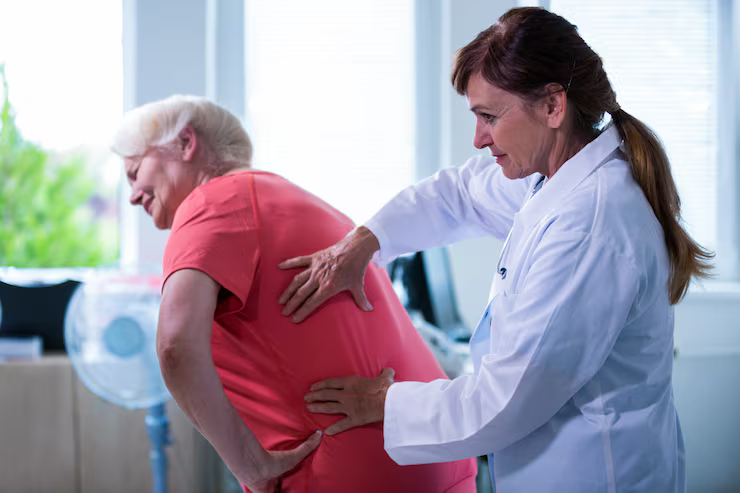  Person holding their painful shoulder.