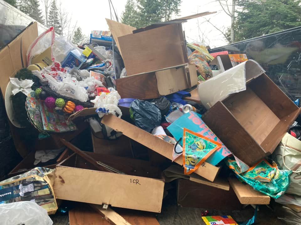 a pile of garbage is sitting on the side of the road .