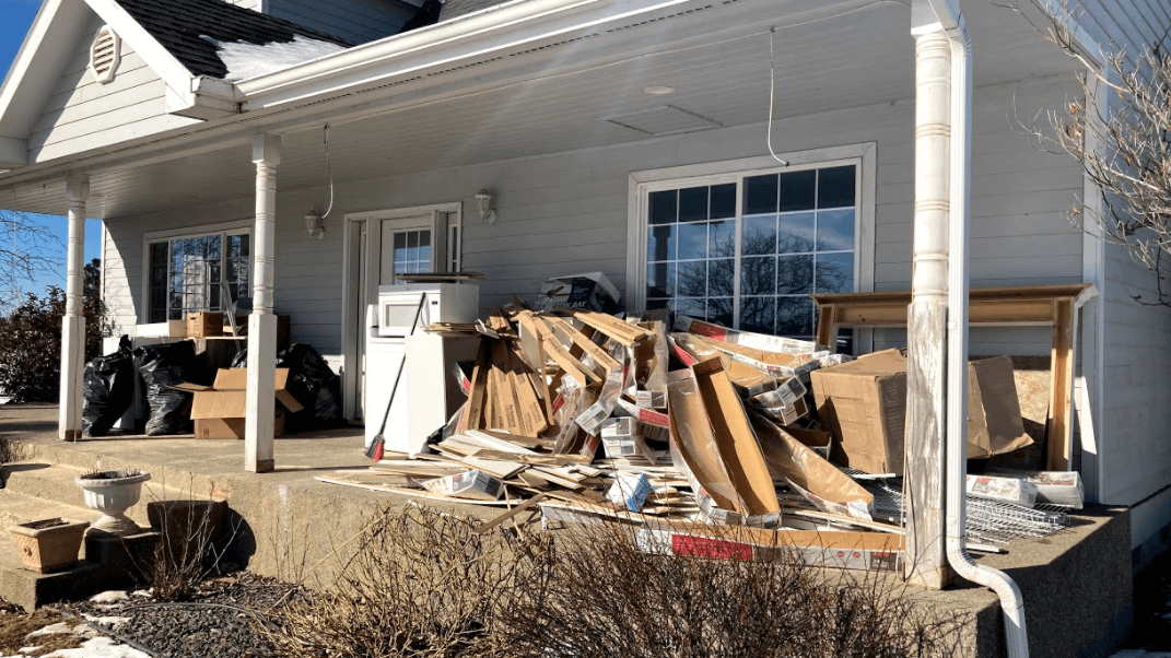 we removed a lot of trash and junk on the porch of a house