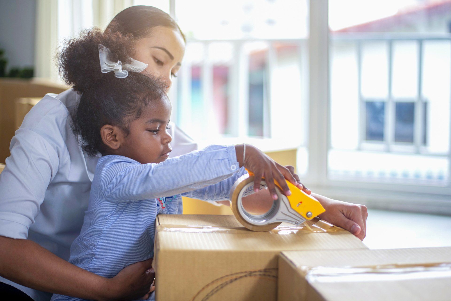 Mother And Her Small Daughter In Cardboard Box - Yaphank, NY - Certified Van Service