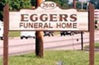 Sign for Eggers Funeral Home by a roadside, with address 2600 visible.