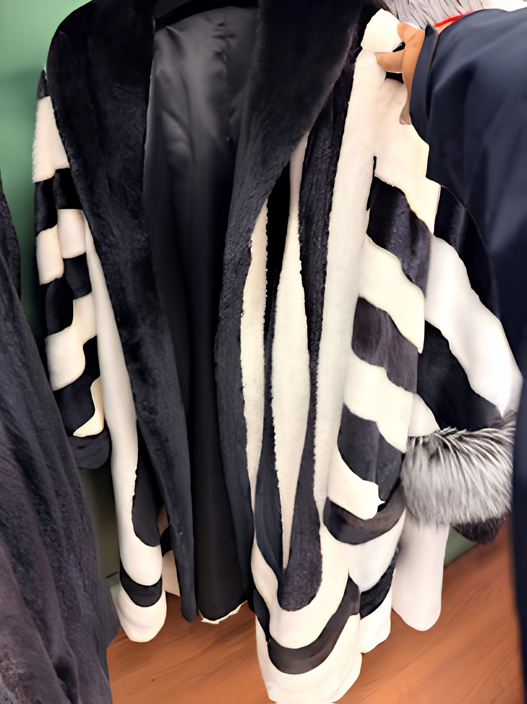 Handcrafted black and white geometric pattern fur coat with plush silver fox cuffs at USA Furs by George Manhattan
