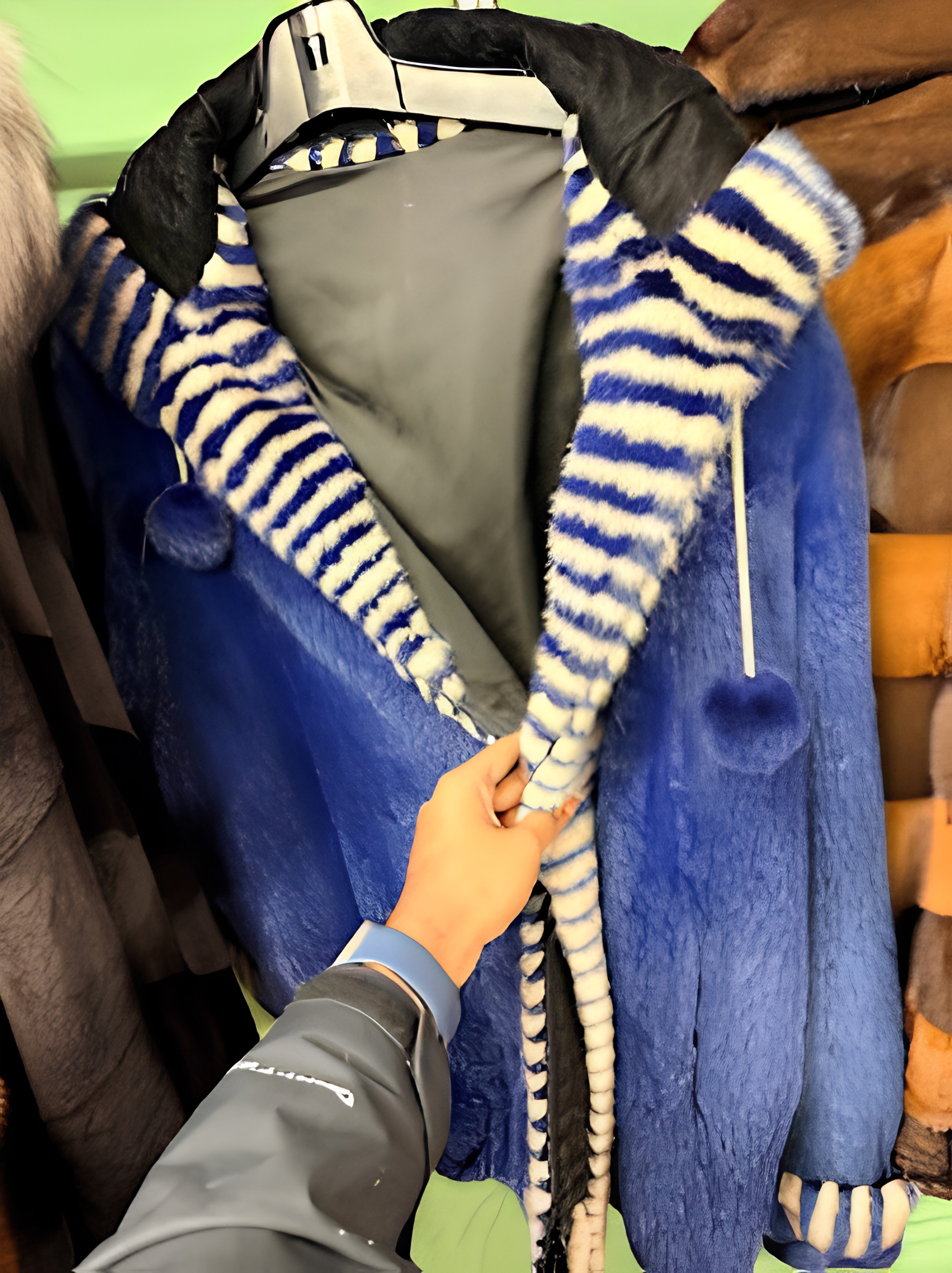 Custom royal blue fur jacket with blue and white striped hood lining at USA Furs by George NYC