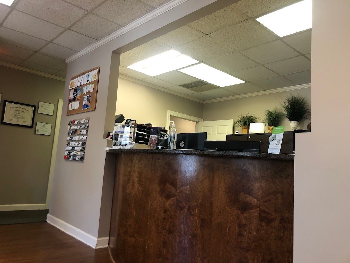A reception desk with a computer on it