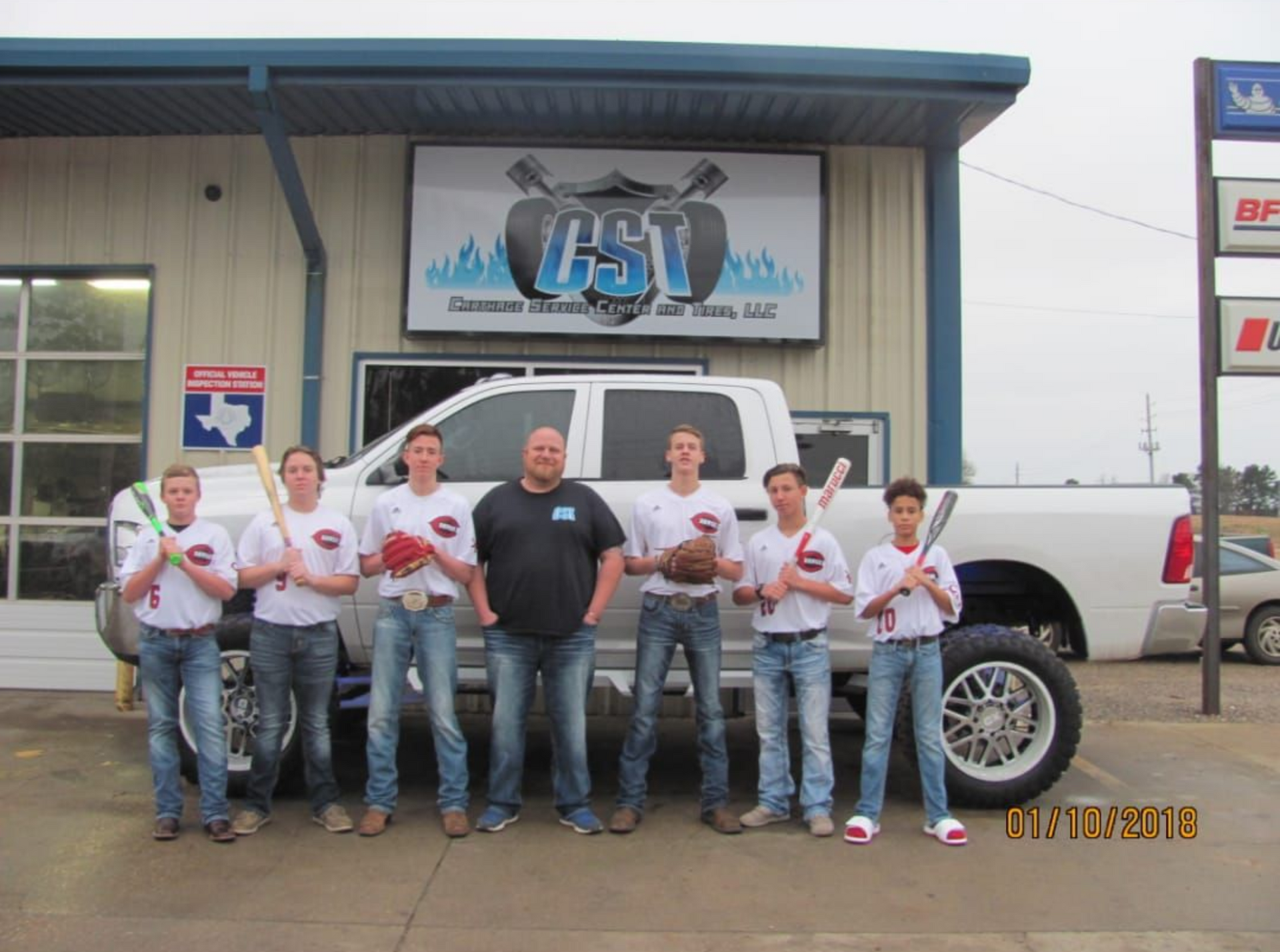 Carthage Service Center And Tires Team Outside Shop Building | Carthage Service Center and Tires